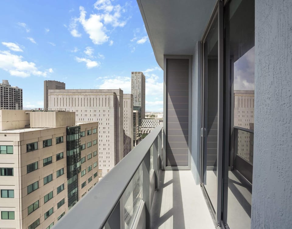 Relax on the balcony and take in panoramic views of the vibrant city skyline.
