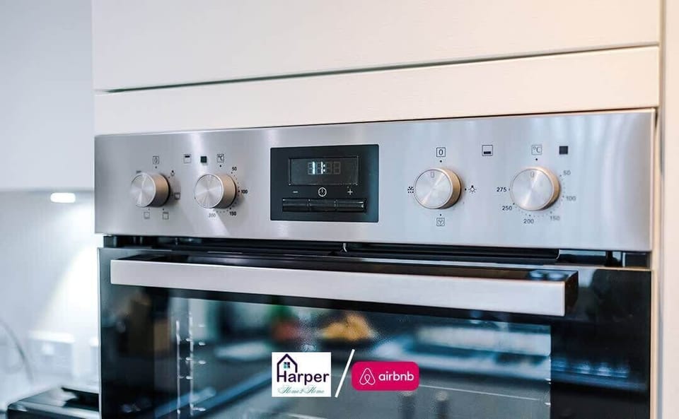 Cook with ease in this bright, spotless kitchen featuring sleek white cabinets, full oven setup, and all essentials for a comfortable stay. Perfect for families, contractors, or long stays.