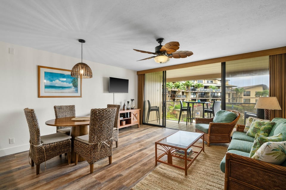 Open-concept living and dining with lanai views—relaxed island comfort