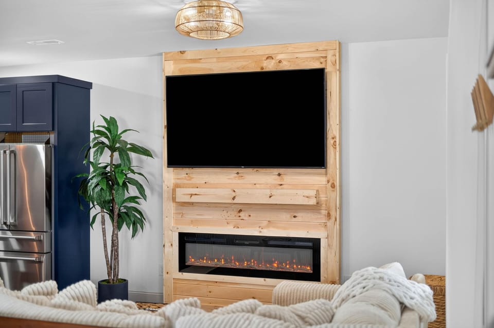 Cozy living room with modern fireplace and entertainment center