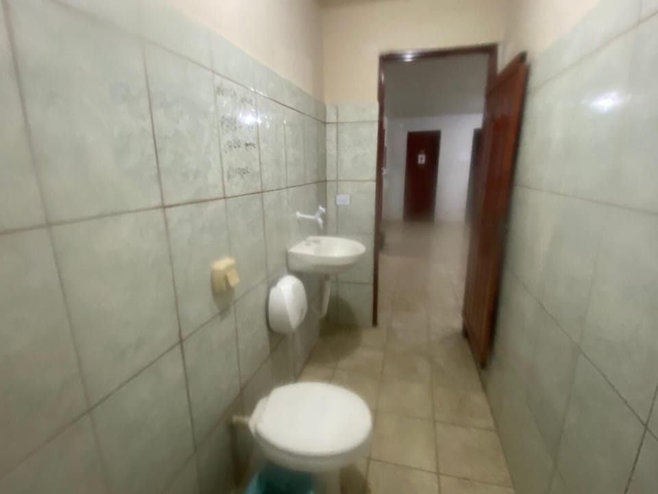 Economy Quadruple Room, Courtyard View | Bathroom | Shower, towels