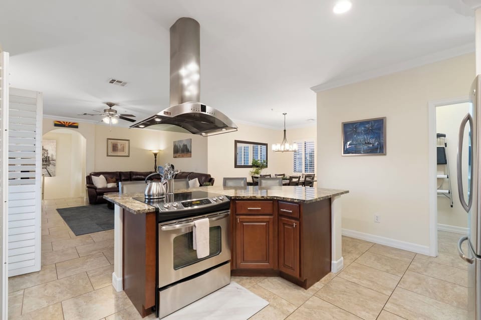 Glass-top stove and oven with plenty of cooking and baking dishes and utencils!
