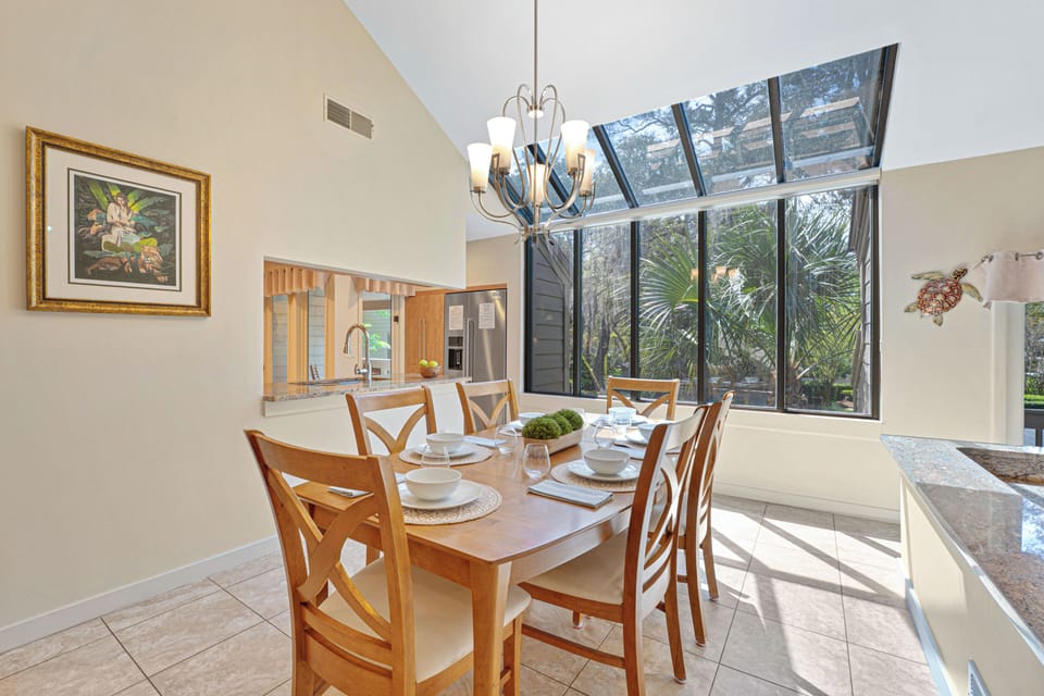 The open pass-through to the kitchen keeps everything flowing—meals, conversation, and time together all come naturally here.