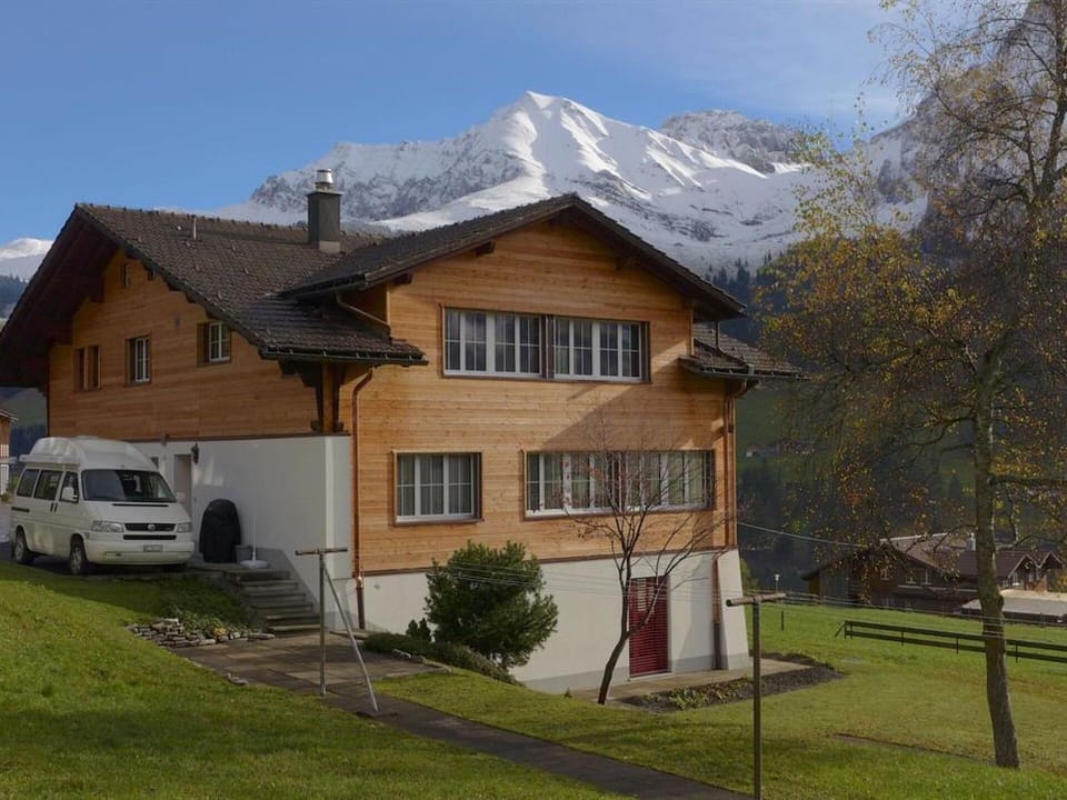 Sky, Plant, Building, Window, Car, Vehicle, Cloud, Mountain, Wheel, House