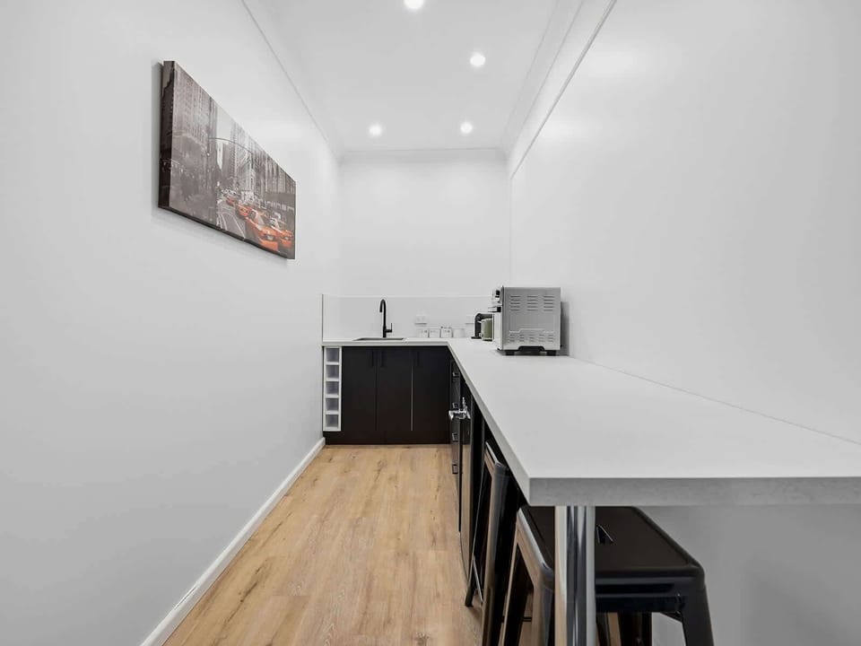 Kitchen + Coffee Machine + Breakfast Bar with Stools
