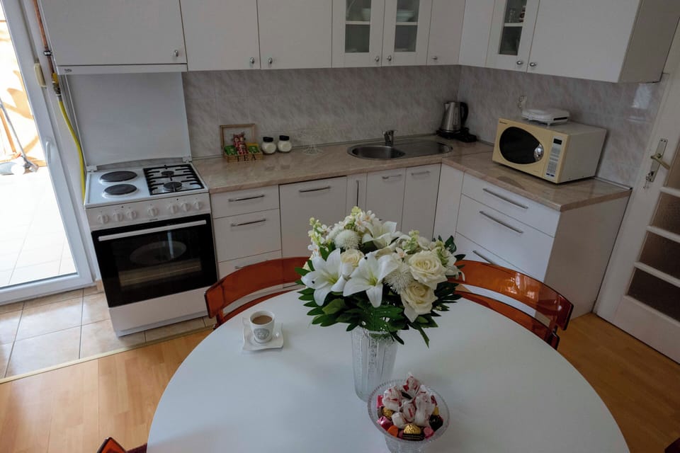 Family Apartment, 2 Bedrooms, Balcony, Garden View | Private kitchen | Full-size fridge, microwave, oven, stovetop