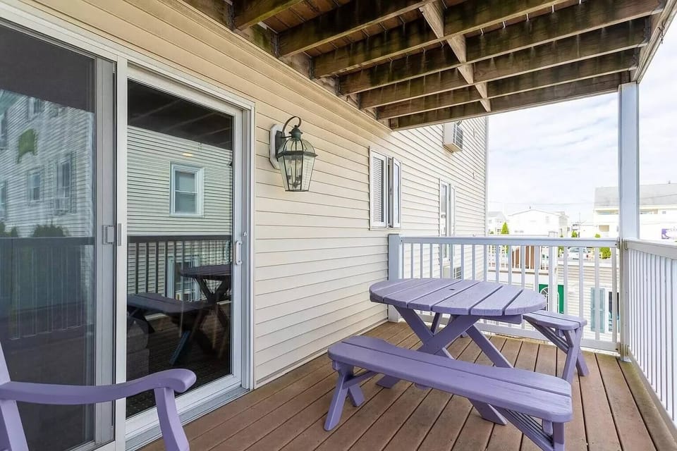 This unit has a balcony with seating. 