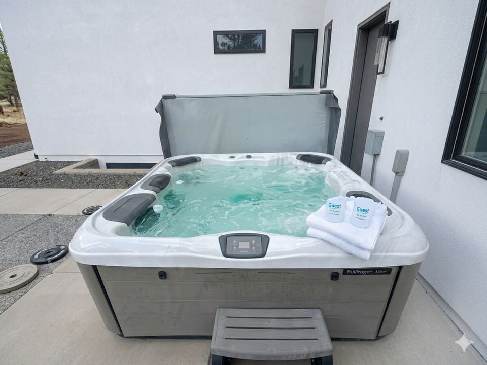 8 person hot tub located right around the corner from the outdoor entertainment area