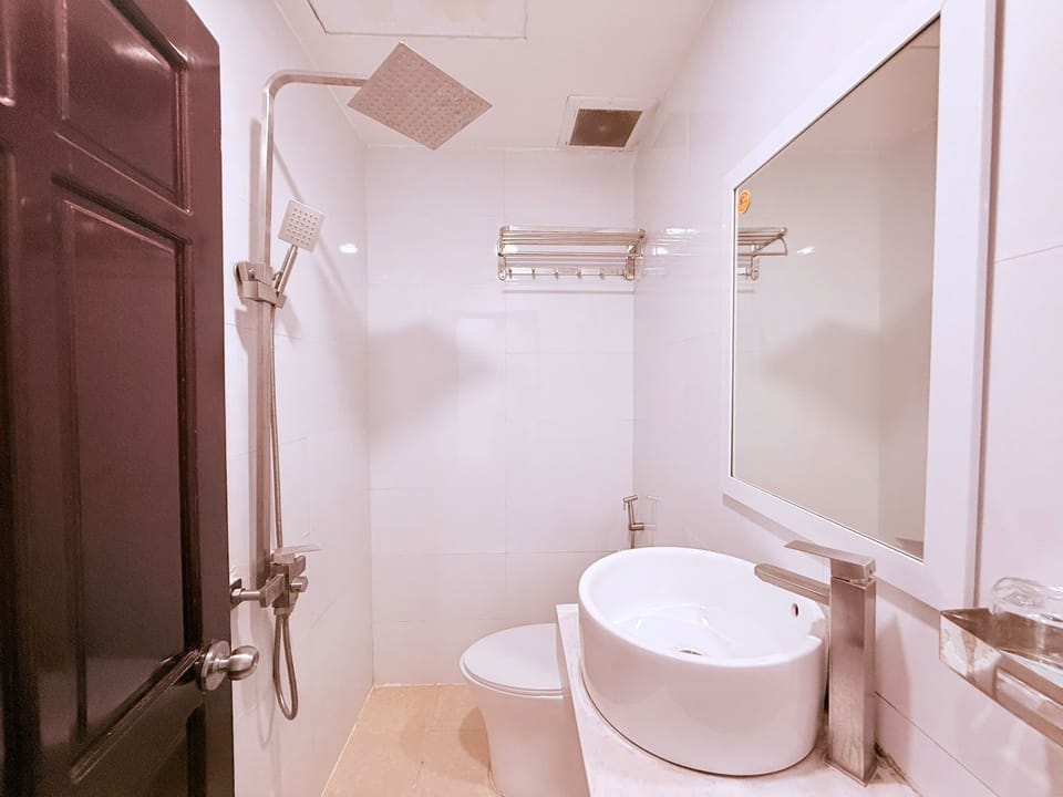 Deluxe Double Room Single Use, 1 Queen Bed, City View | Bathroom | Hair dryer, slippers, towels, soap