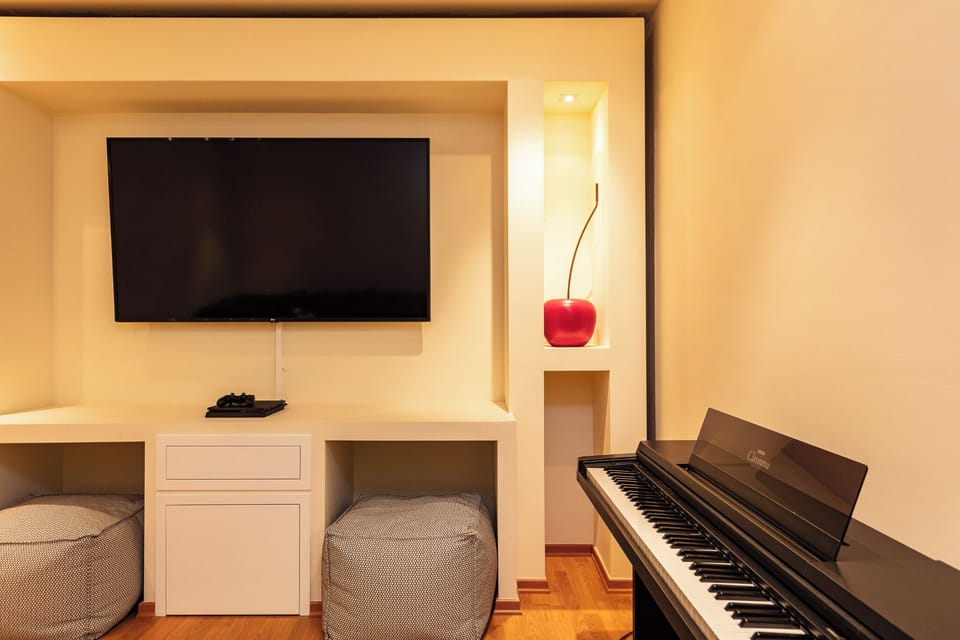 Villa, Sea View | Living area | 50-inch Smart TV with cable channels, fireplace, video-game console
