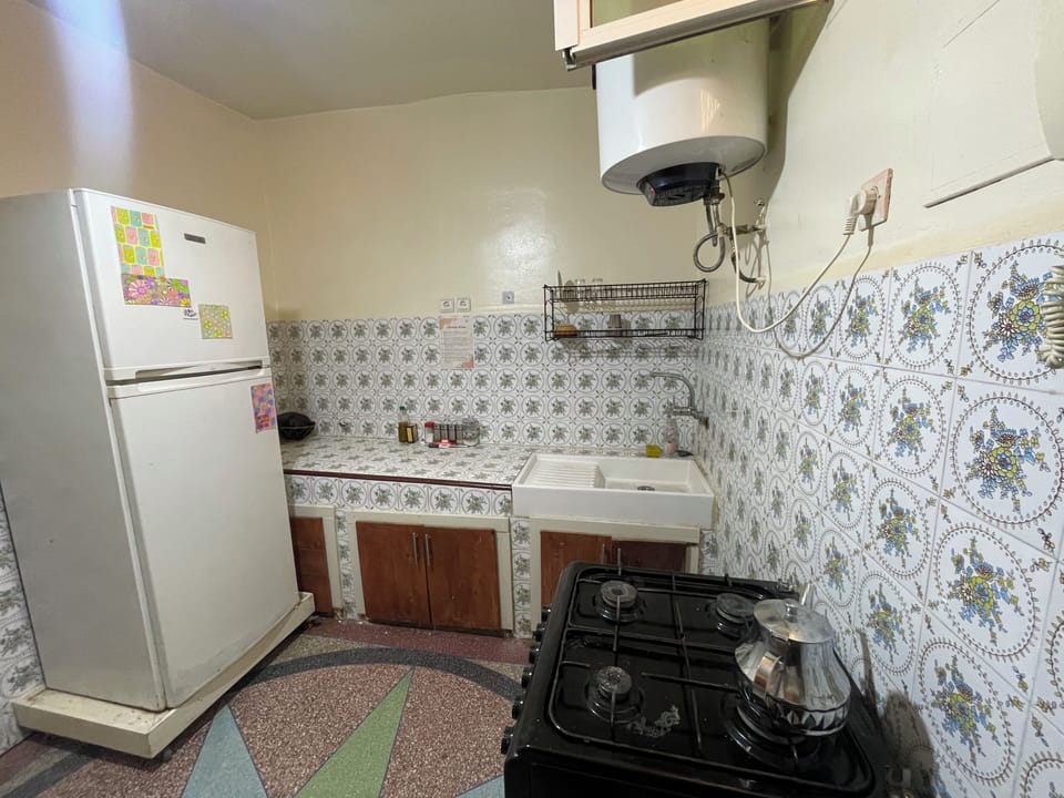 Full-size fridge, oven, stovetop, cookware/dishes/utensils