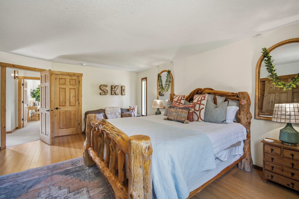 Sink into your handcrafted log bed surrounded by rustic charm and cozy touches that make this mountain retreat feel like home.