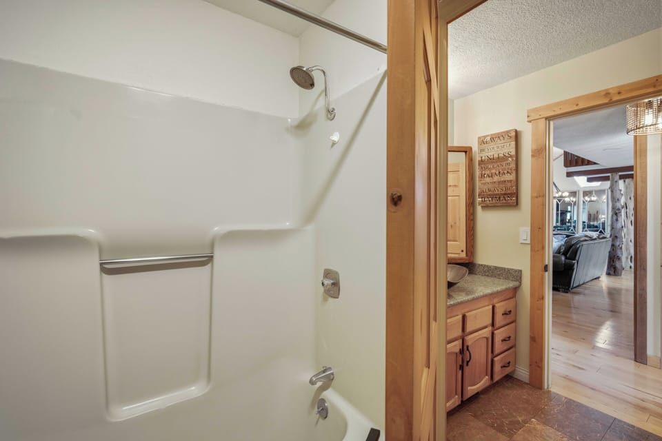 Your private bathroom features a spacious shower-tub combo and granite vanity, perfectly connecting to your cozy bedroom retreat.