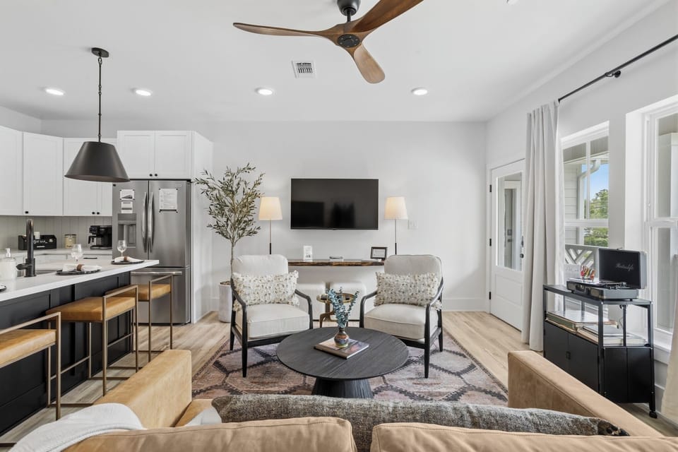 Relax in this elegant yet comfy living room--complete with record player and art supplies for maximum creative inspiration!