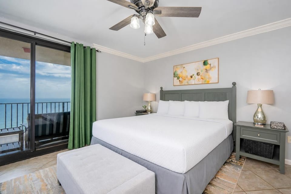Drift into restful sleep in this serene king master suite, with captivating coastal views from your balcony