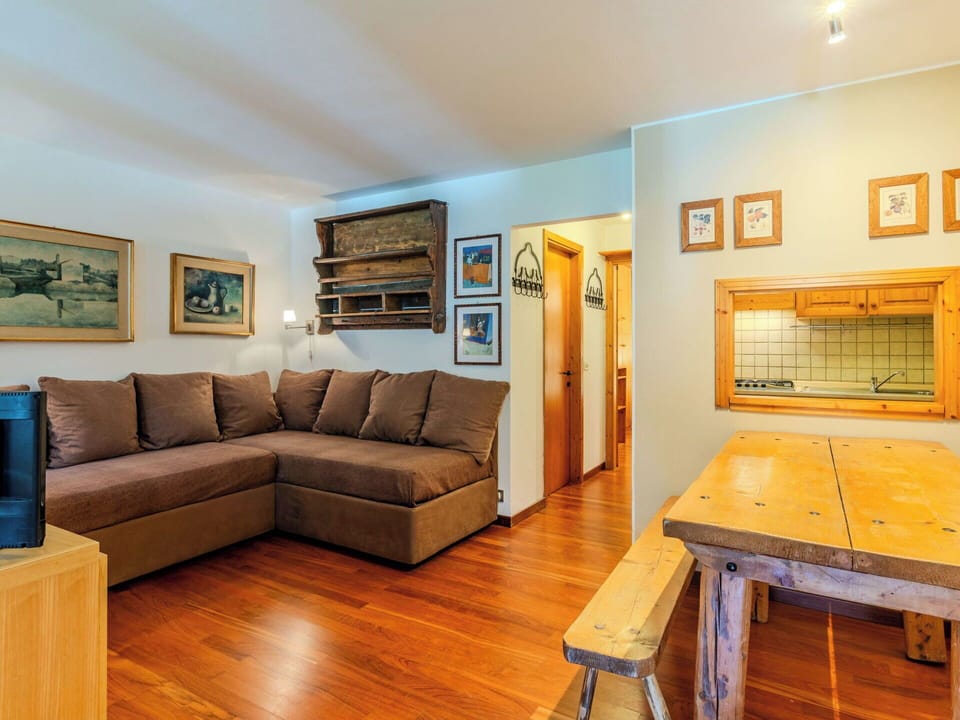 Furniture, Interior Design, Couch, Flooring, Wood, Floor, Ceiling, Room, Living Room, Picture Frame