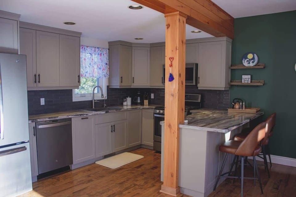 Full kitchen; fridge & freezer, stove & oven, microwave, dishwasher, coffee pot & French press. Fully stocked with dishes and glasses. 