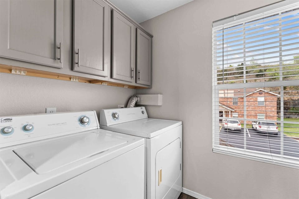 Private laundry is available for your stay, tucked away off the kitchen