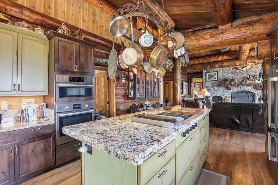 Chef's Kitchen With Island and Stainless Steel Appliances