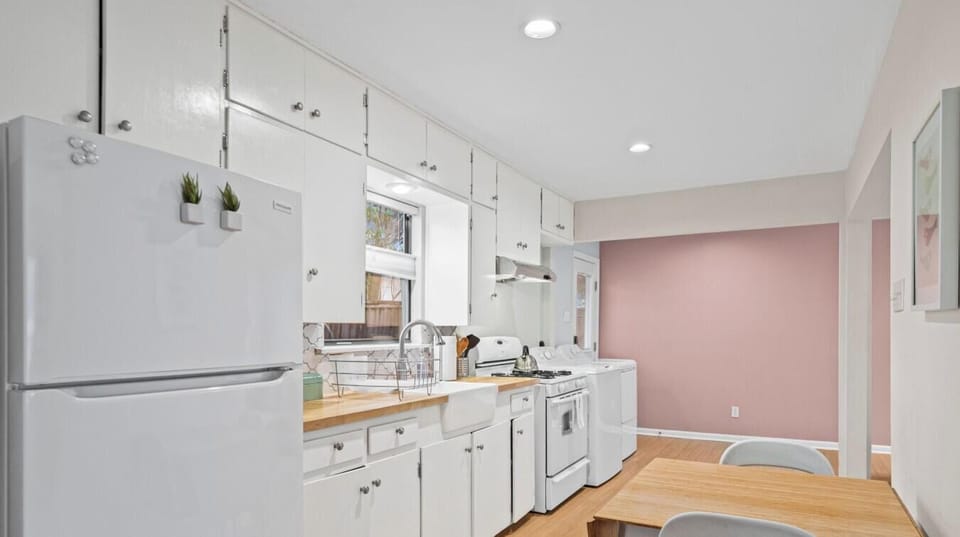 The galley kitchen flows into a dining nook — pull up a chair and enjoy a home-cooked meal.