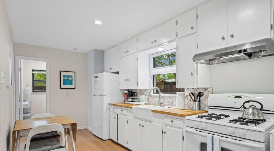 Whip up meals in the fully equipped kitchen with gas stove, farmhouse sink, and butcher-block counters.