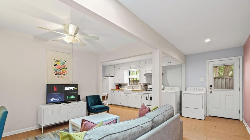 Open sightlines connect living room, kitchen, and dining — a cozy layout that lives bigger than you`d expect.