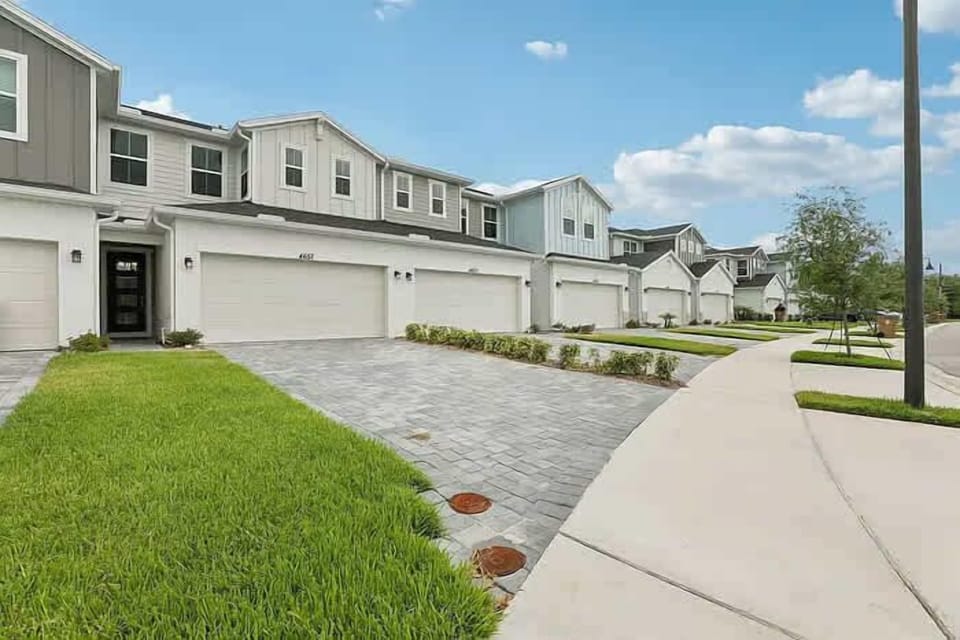 Explore this charming townhouse community with modern amenities and spacious garages, perfect for a comfortable stay.