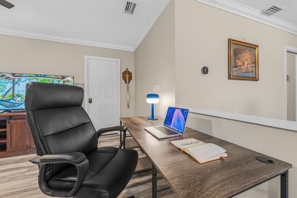 Dedicated workspace with desk, comfortable chair, and open view—perfect for remote work or planning your day.