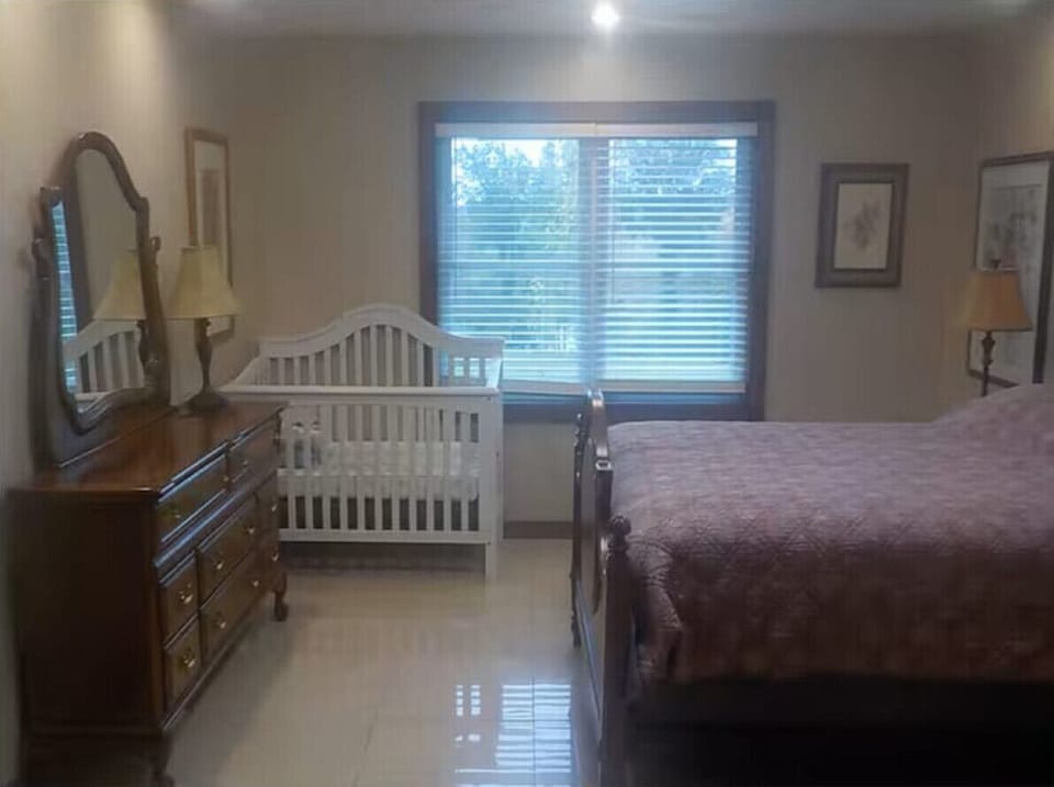 Bedroom 1 | Queen Bed & Crib Area | Large Window Light