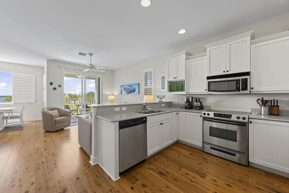Bright, modern kitchen with spacious island and ocean views