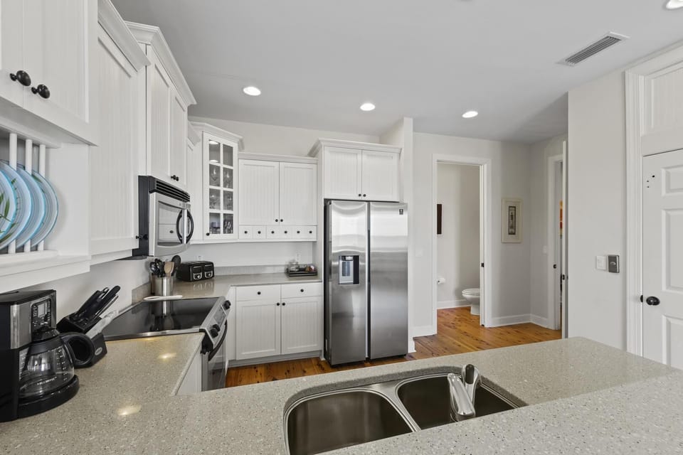 Bright, modern kitchen with stainless steel appliances and ample counter space
