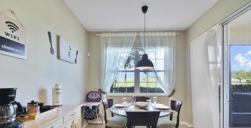 Cozy dining area with natural light and garden views, perfect for family meals.