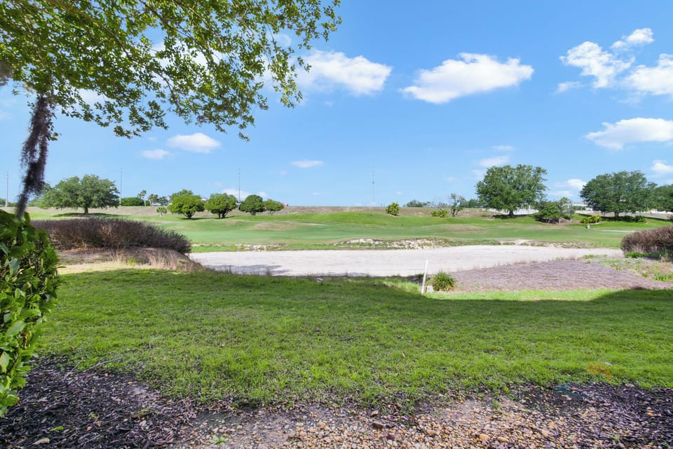 Scenic golf course view from the backyard, perfect for relaxation and nature lovers.