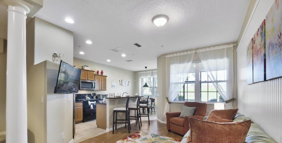 Inviting open-plan living area with cozy seating and a view of the kitchen.