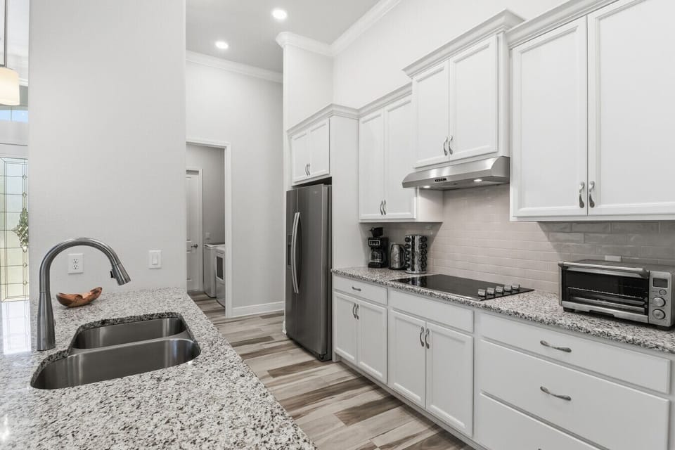 Kitchen | Stainless Appliances, Electric Cooktop & Coffee Station | Toaster Oven & Granite Counters