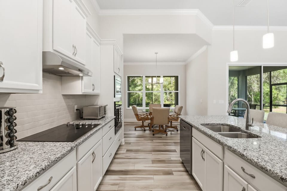 Kitchen | Stainless Appliances, Electric Cooktop & Coffee Station | Toaster Oven & Granite Counters