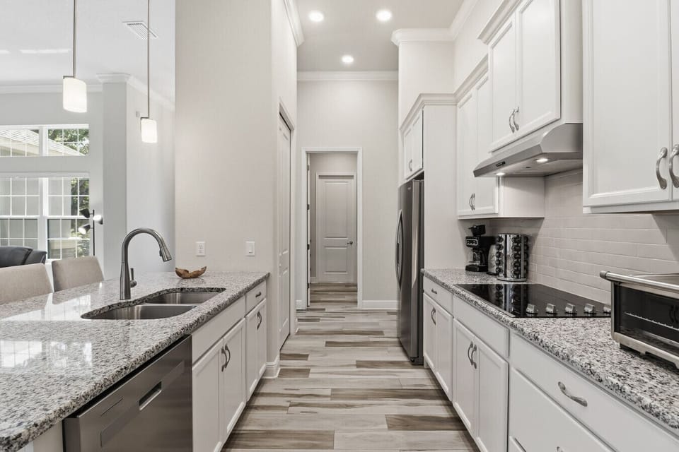 Kitchen | Stainless Appliances, Electric Cooktop & Coffee Station | Toaster Oven & Granite Counters