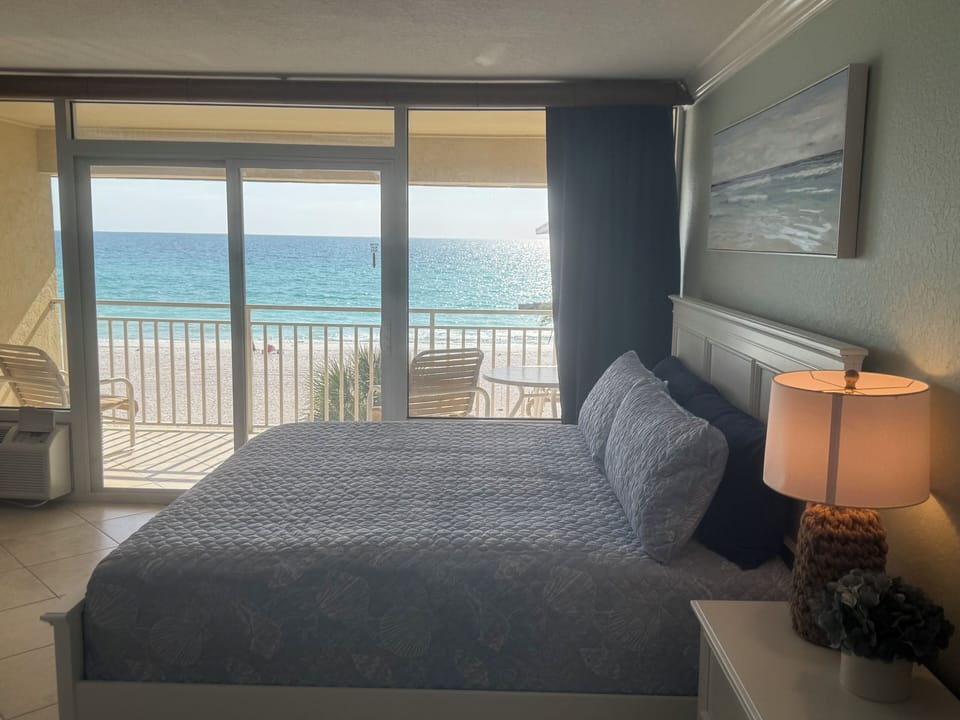 Living area / king size bed with balcony, overlooking the beach.