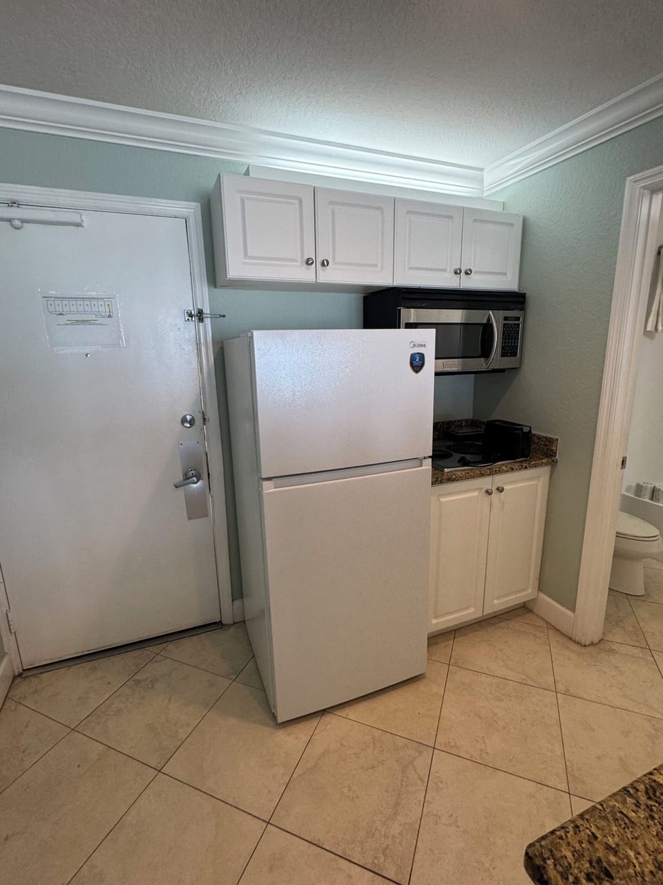 Microwave, toaster, fridge, two burner stove, keurig coffee maker, all utensils