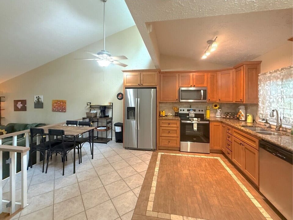 Bright open kitchen and dining area with full-size appliances, plenty of prep space, and everything you need for easy meals at home
