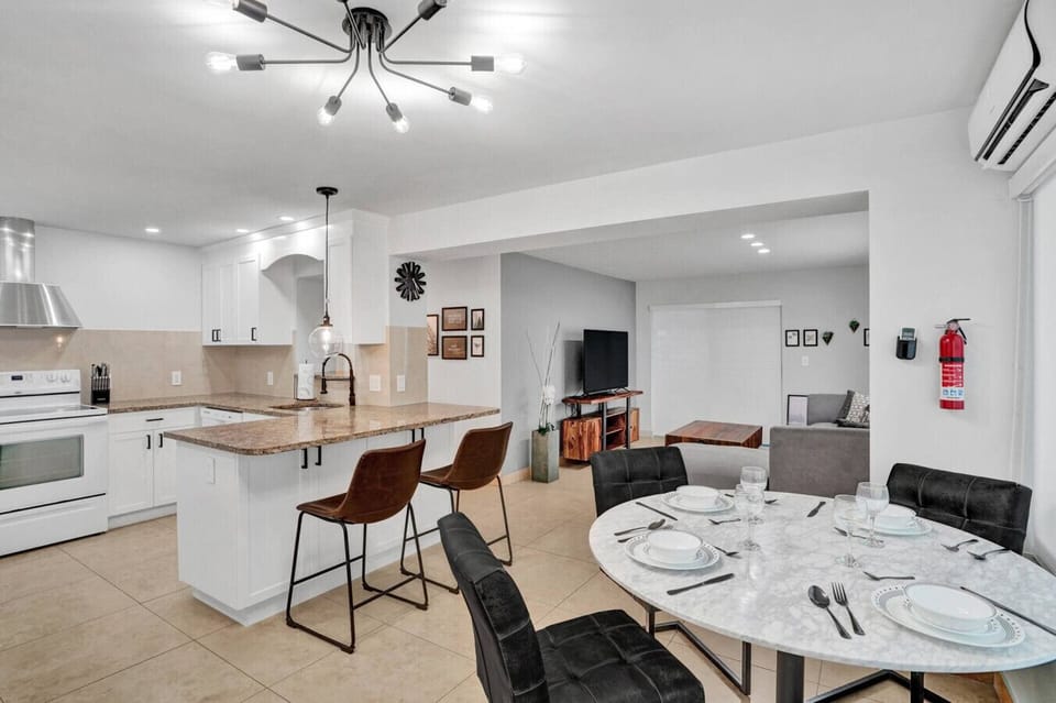 Spacious Kitchen with Bar Seating — Cook & Gather Easily