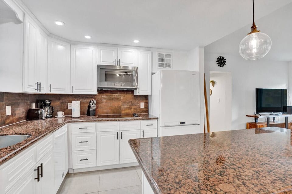 Spacious Kitchen with Bar Seating — Cook & Gather Easily