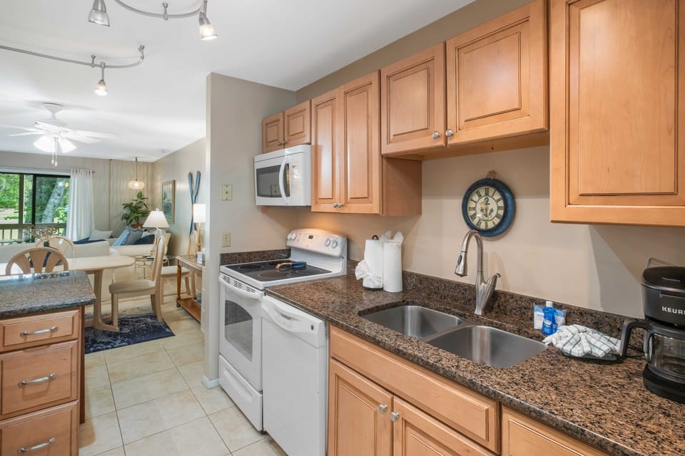 Full size kitchen stocked with all the essentials for meal prep and dining