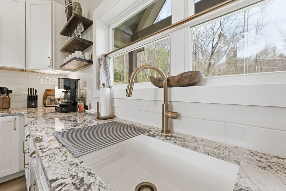 A bright and airy kitchen space where even washing up comes with a view.