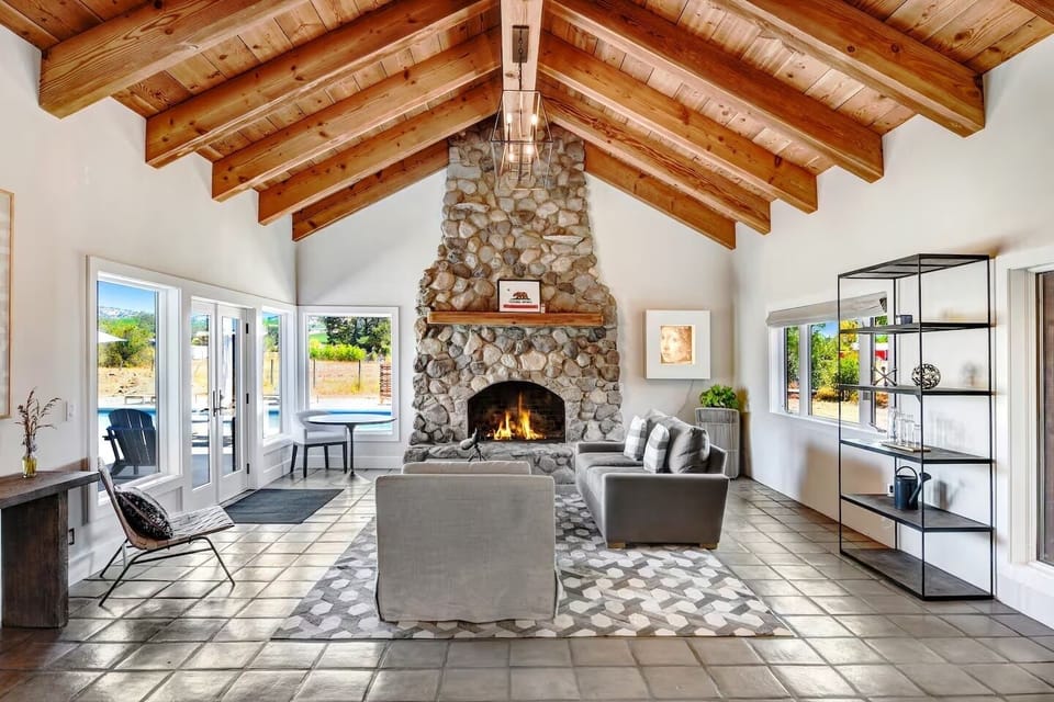 A cozy Living Room filled with natural light and views all around. Gather here with your friends for a memorable game night!