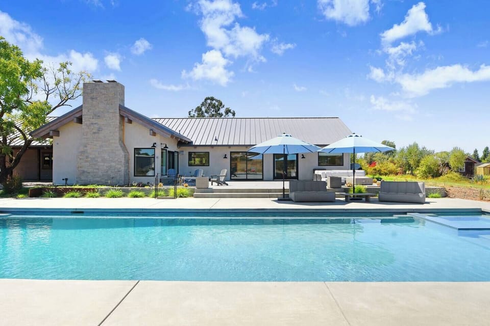 The sparkling pool, hot tub and lounge area to spend the day with friends and family.