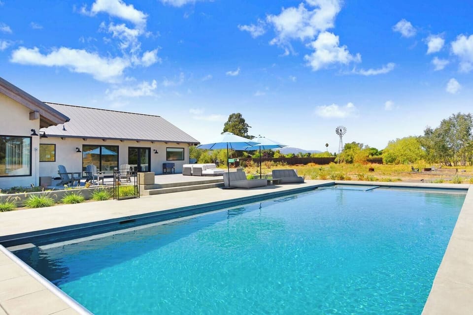 Great for swimming laps or lounging in this large pool with hot tub.
