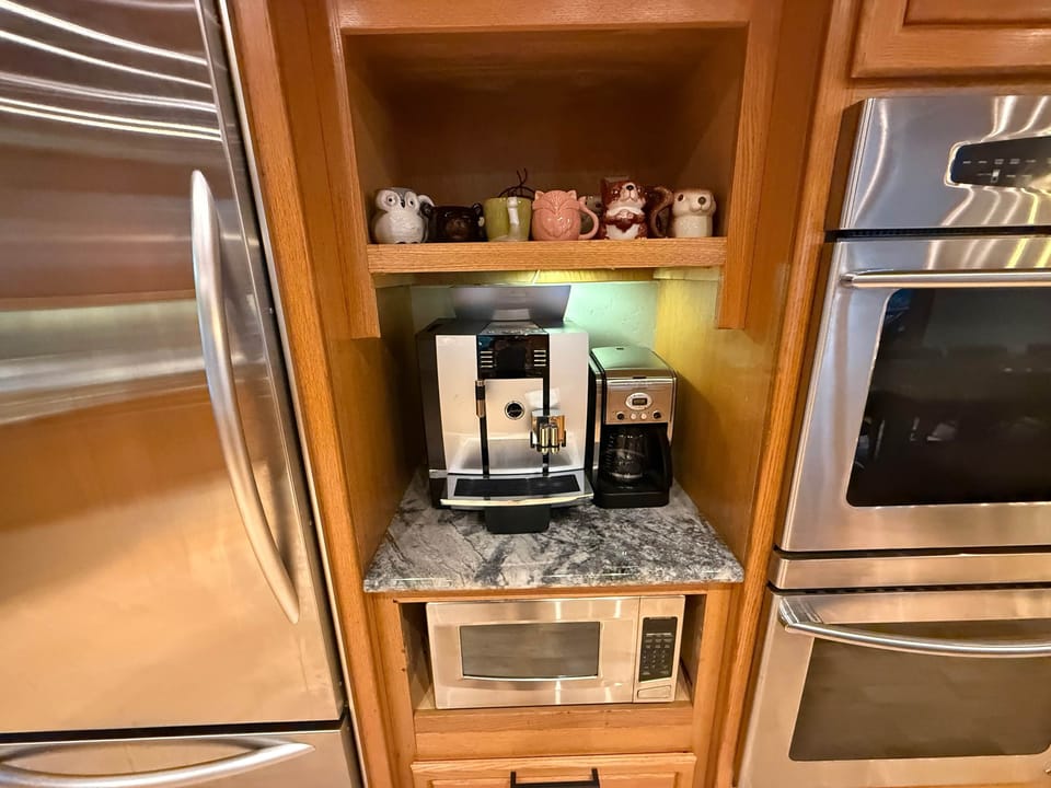 Jura automatic espresso and coffee machine, drip coffee machine, creamers and sugar included.