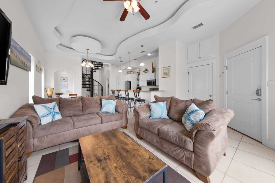 Bright living and kitchen areas under high ceilings