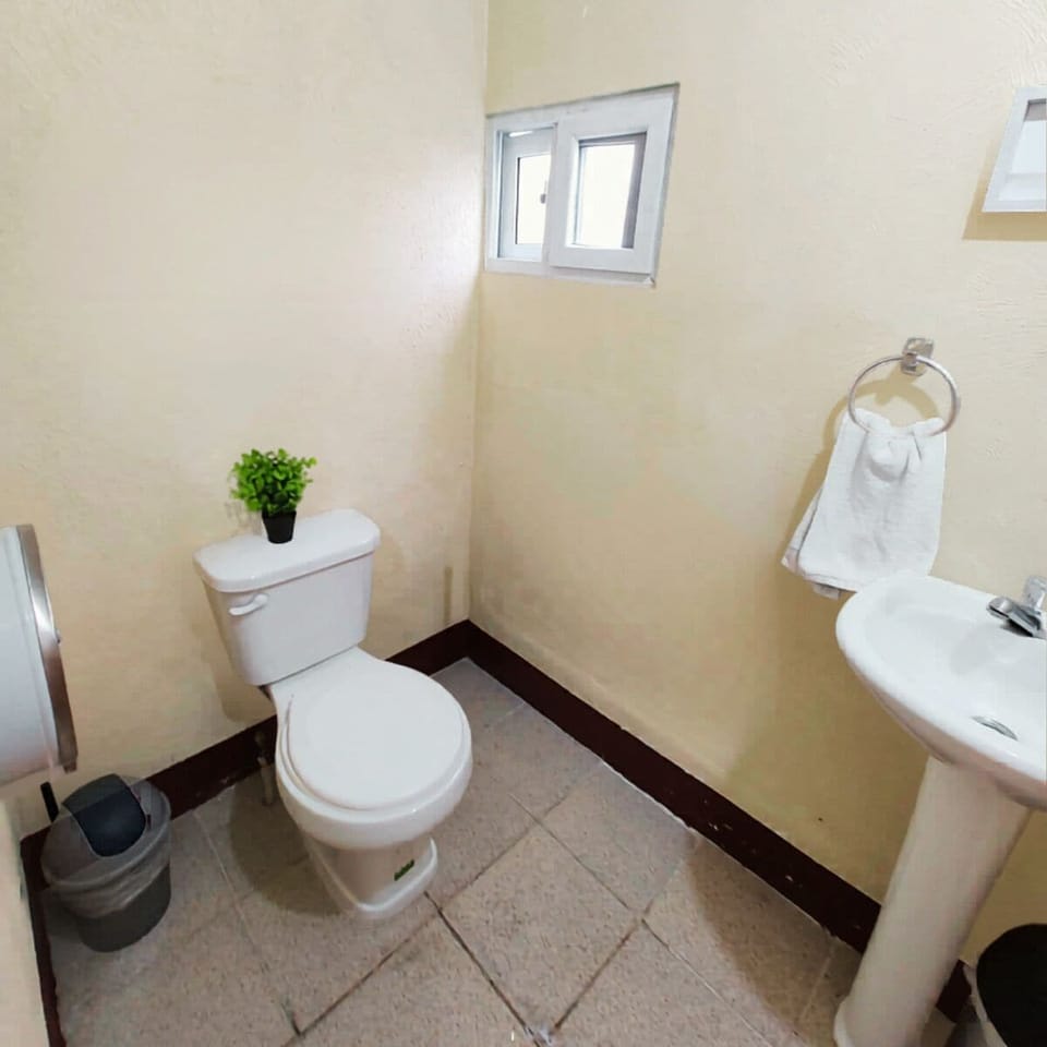 Economy Shared Dormitory | Bathroom | Shower, towels, soap, shampoo
